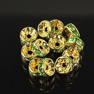 Distantiere aurii cu rhinestones verzi 8mm (rondele 3,5x8mm)