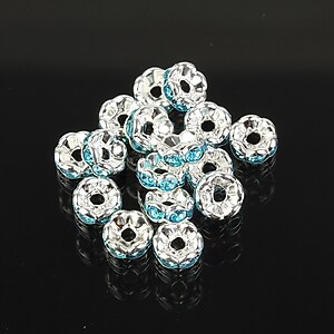 Distantiere argintii floare cu rhinestones bleu 6mm (3x6mm)