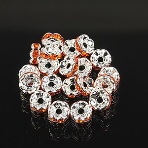 Distantiere argintii floare cu rhinestones portocalii 6mm (3x6mm)